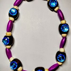 Blue jewel on wooden bead necklace